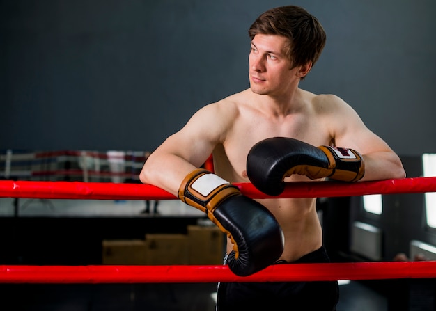 Boxer boy posing at the gym