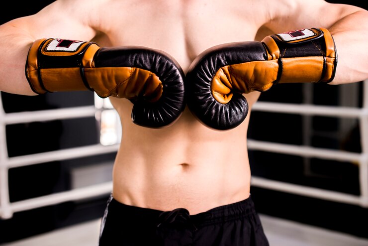 Free Photo boxer boy posing at the gym