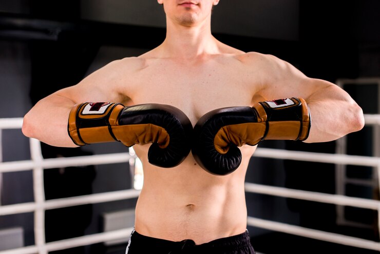 Free Photo boxer boy posing at the gym