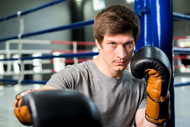 Boxer boy posing at the gym