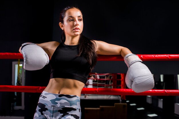 Boxer girl posing at the gym