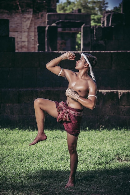 A boxer tied a rope in his hand and performed a fight, The martial arts of Muay Thai.