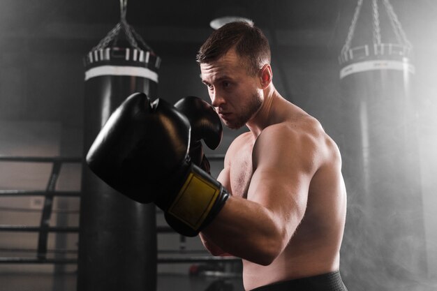 Boxer with black gloves training