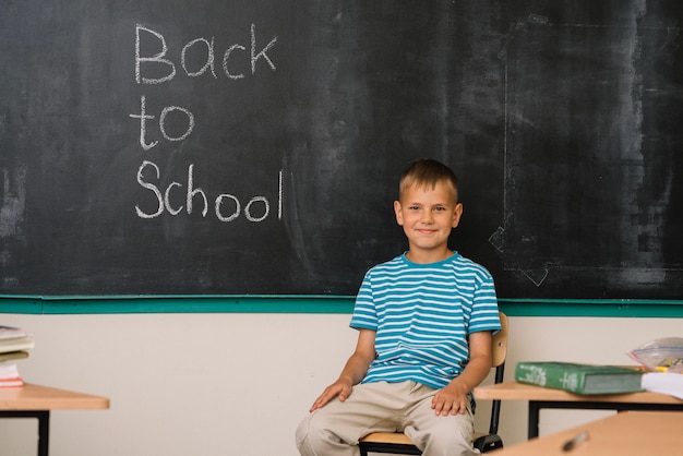 Boy at blackboard in school