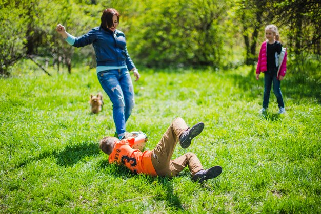 Boy blocking the ball on the grass