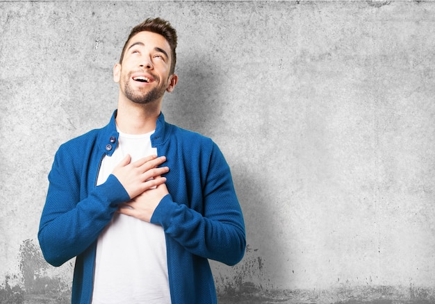 Boy in a blue jacket laughing