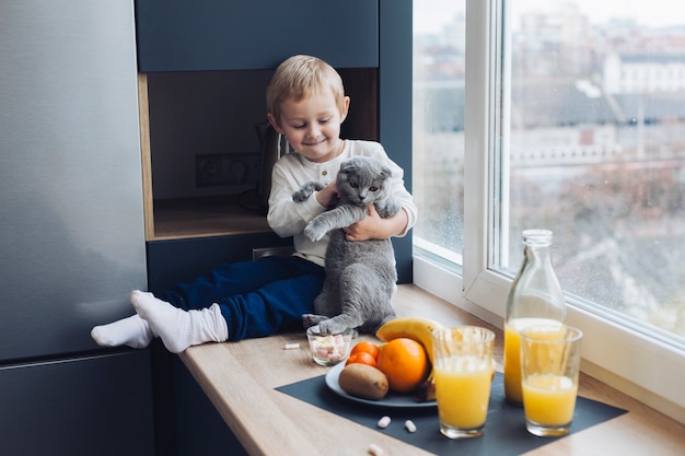 Free photo boy and cat