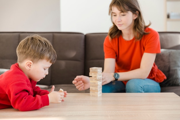 Boy concentrate on janga game