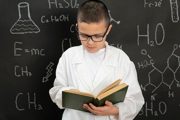 Boy doing experiments in laboratory