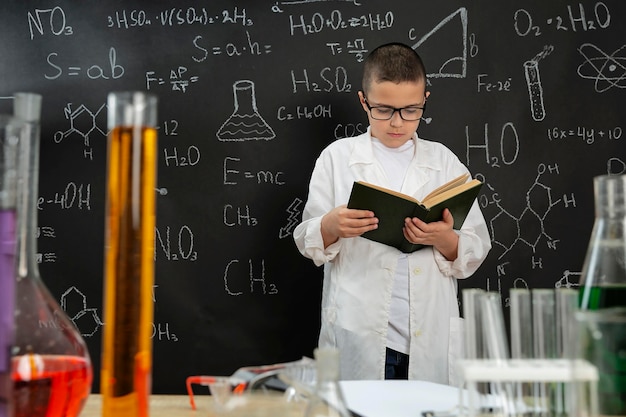 Boy doing experiments in laboratory