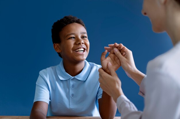 Boy doing a occupational therapy session with a psychologist