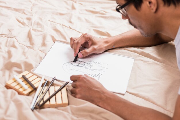 Boy drawing with charcoal