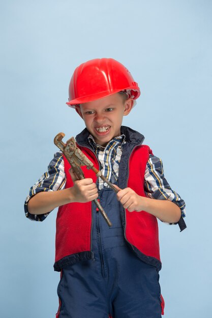 Boy dreaming about future profession of engineer