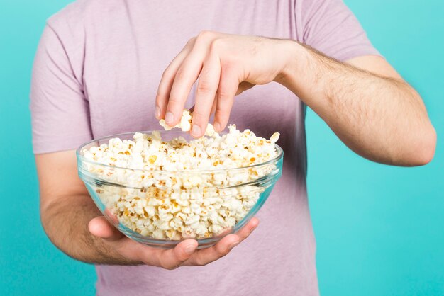 Boy eating pop corn