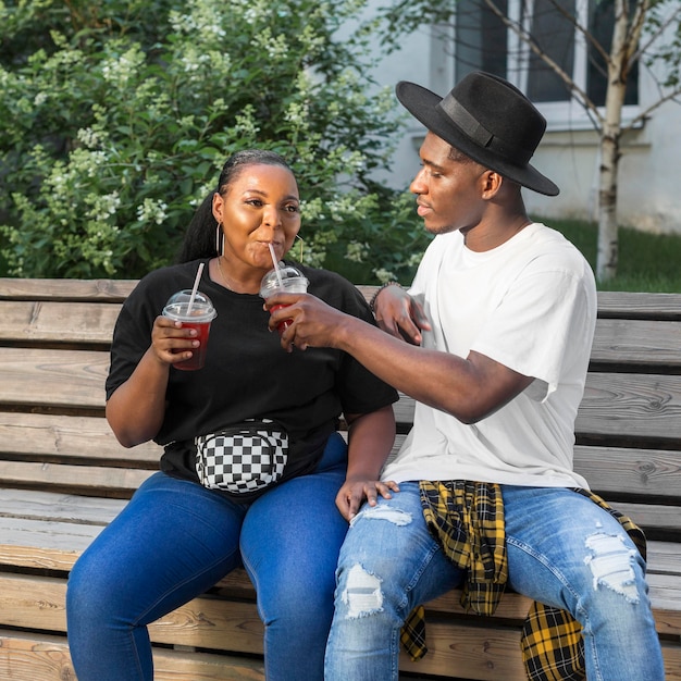 Boy and girl enjoying some smoothies