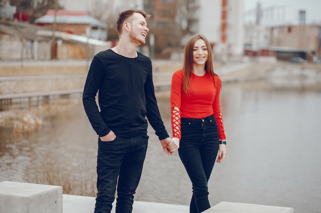 Free photo boy and girl in the park. loving couple walking. couple relaxes.