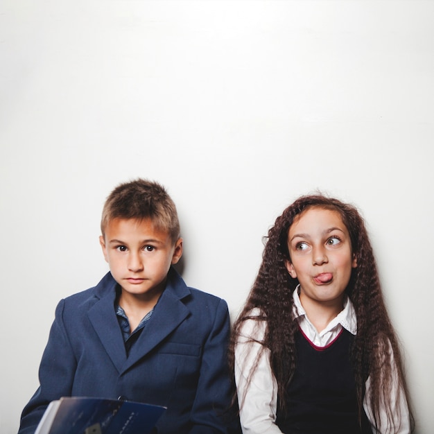 Boy and girl wearing formal clothes