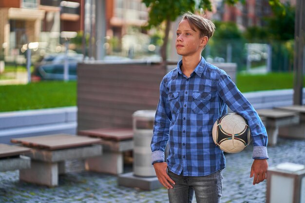 Boy goes to play soccer at school