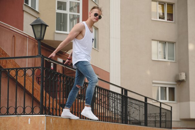 Boy hanging in the air on the buildings scene