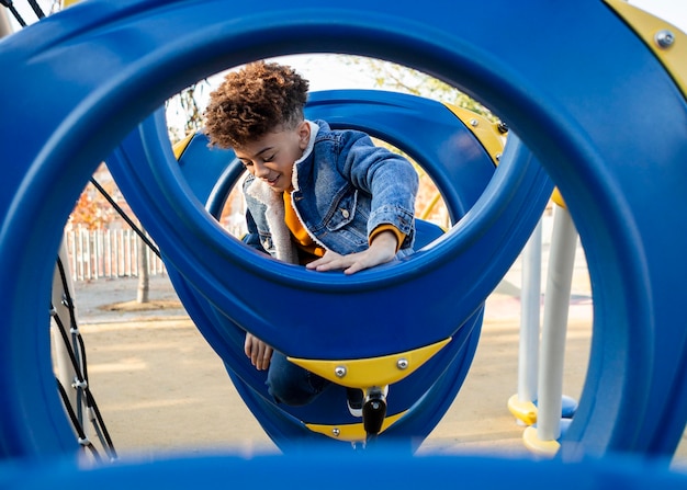 Boy having fun at the playground outside