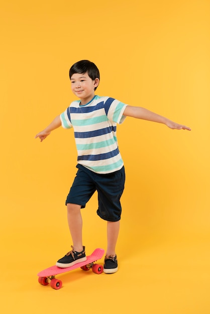 Boy having fun in a summer setting studio