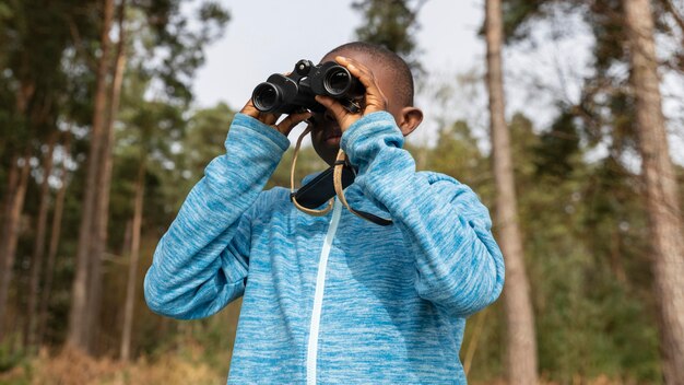 Boy having fun in the woods