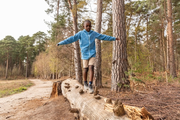 Boy having fun in the woods