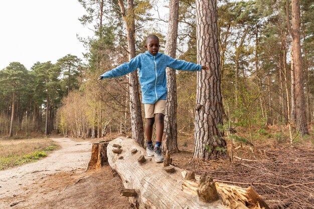 Boy having fun in the woods