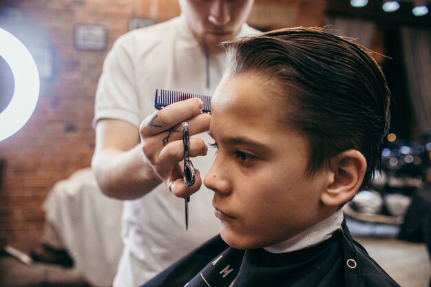 Teenage Boy Haircuts Hairdresser In The Barber Shop Fashionable