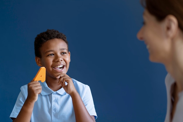 Boy having an occupational therapy session with a psychologist