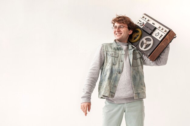 Boy holding cassette with copy-space