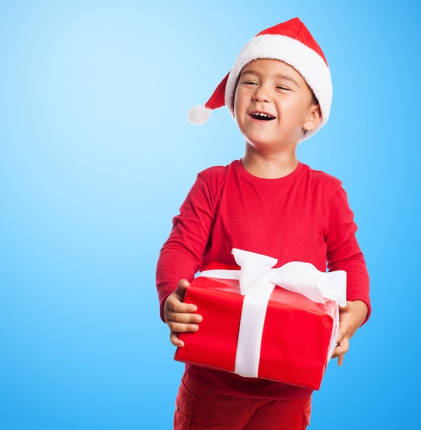 Boy holding a gift