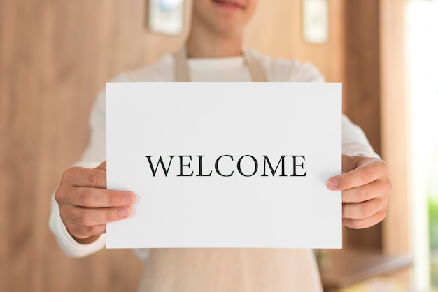 Boy holding a welcome sign after the end of quarantine