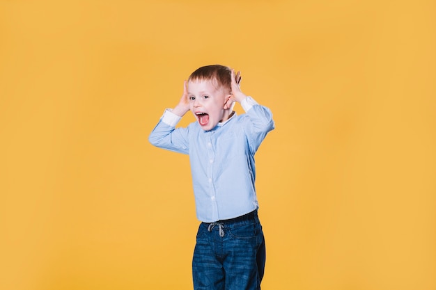 Free photo boy jumping and screaming