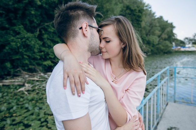 Boy kissing his girlfriend on the head