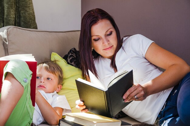 Boy and mother reading books