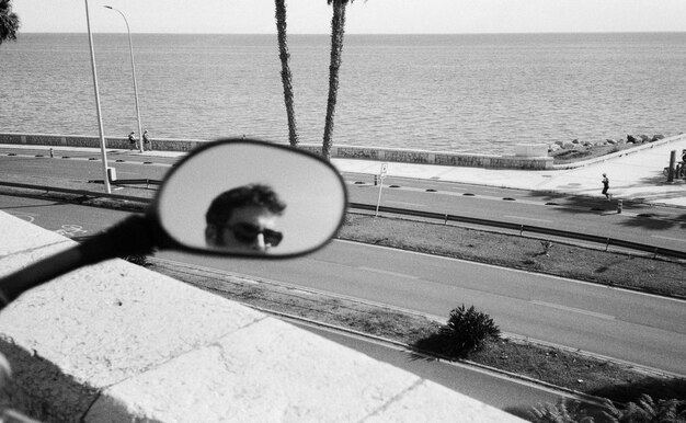 Free photo boy in the motorbike mirror