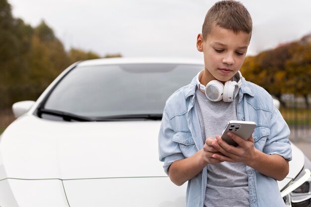 Boy near an electric car