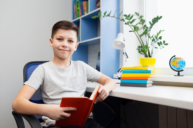 Boy at office reading