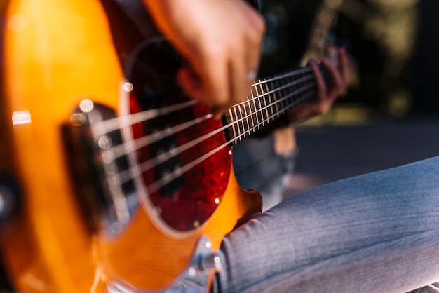 Boy playing the electric guitar