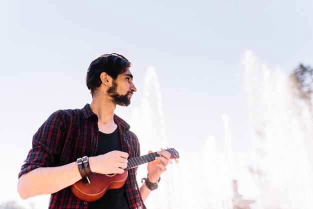 Boy playing the ukelele