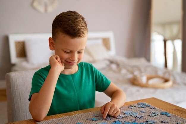 Boy playing with brain teaser toys