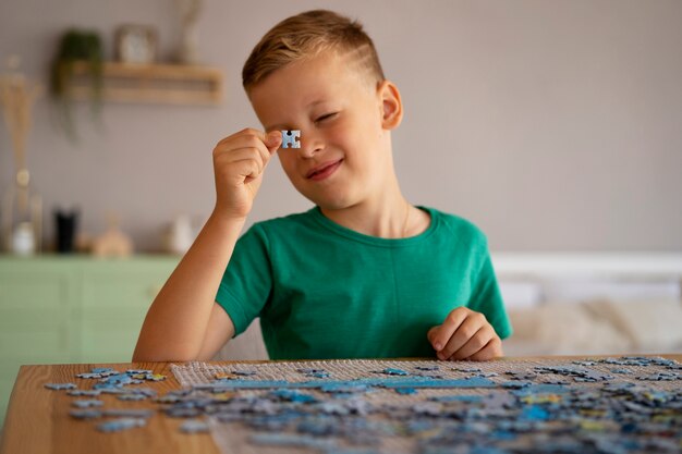 Boy playing with brain teaser toys