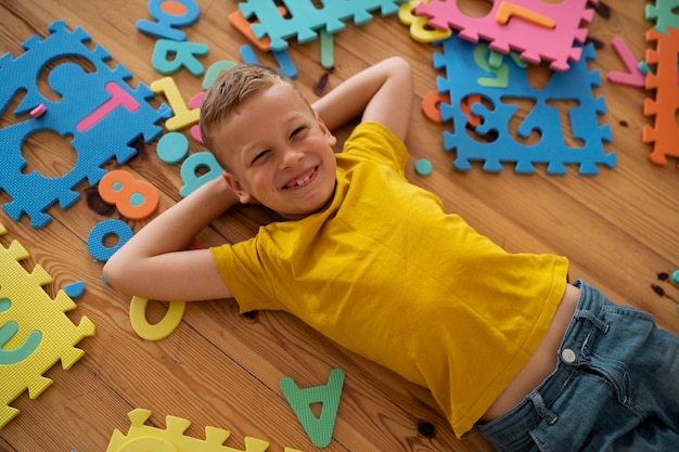 Boy playing with brain teaser toys