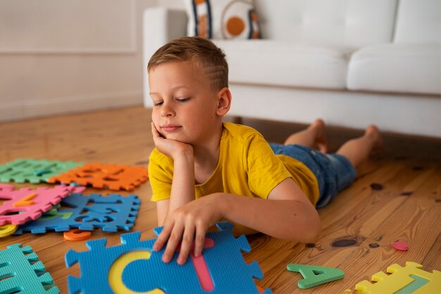 Boy playing with brain teaser toys