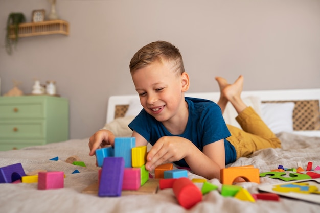 Boy playing with brain teaser toys