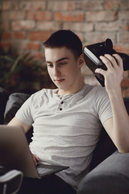 Boy playing with VR headset at home