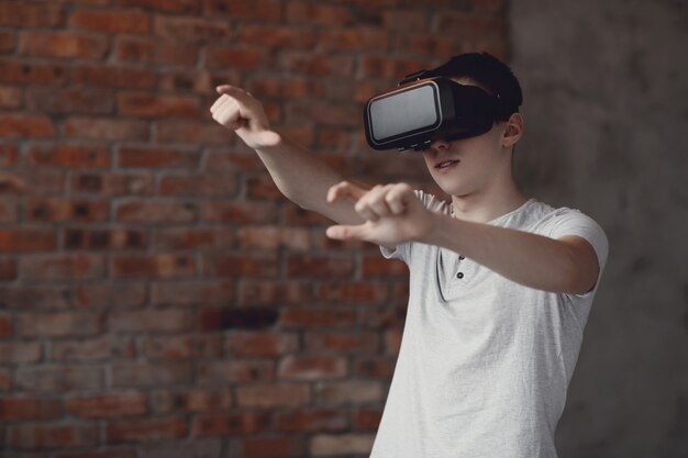 Boy playing with VR headset at home