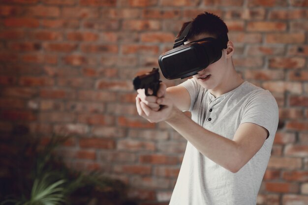 Boy playing with VR headset at home