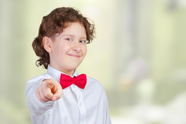 Boy pointing with finger at someone